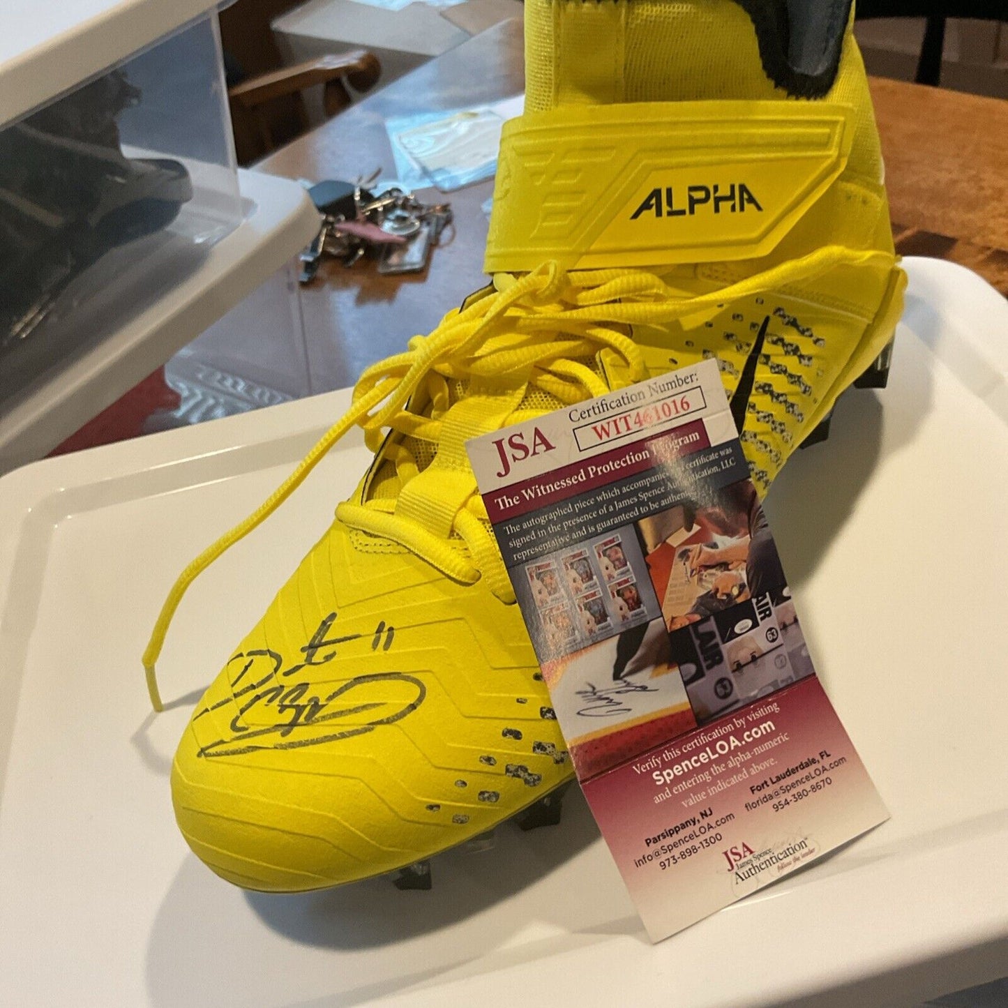 Autographed cleats by HOF Daunte Culpper 