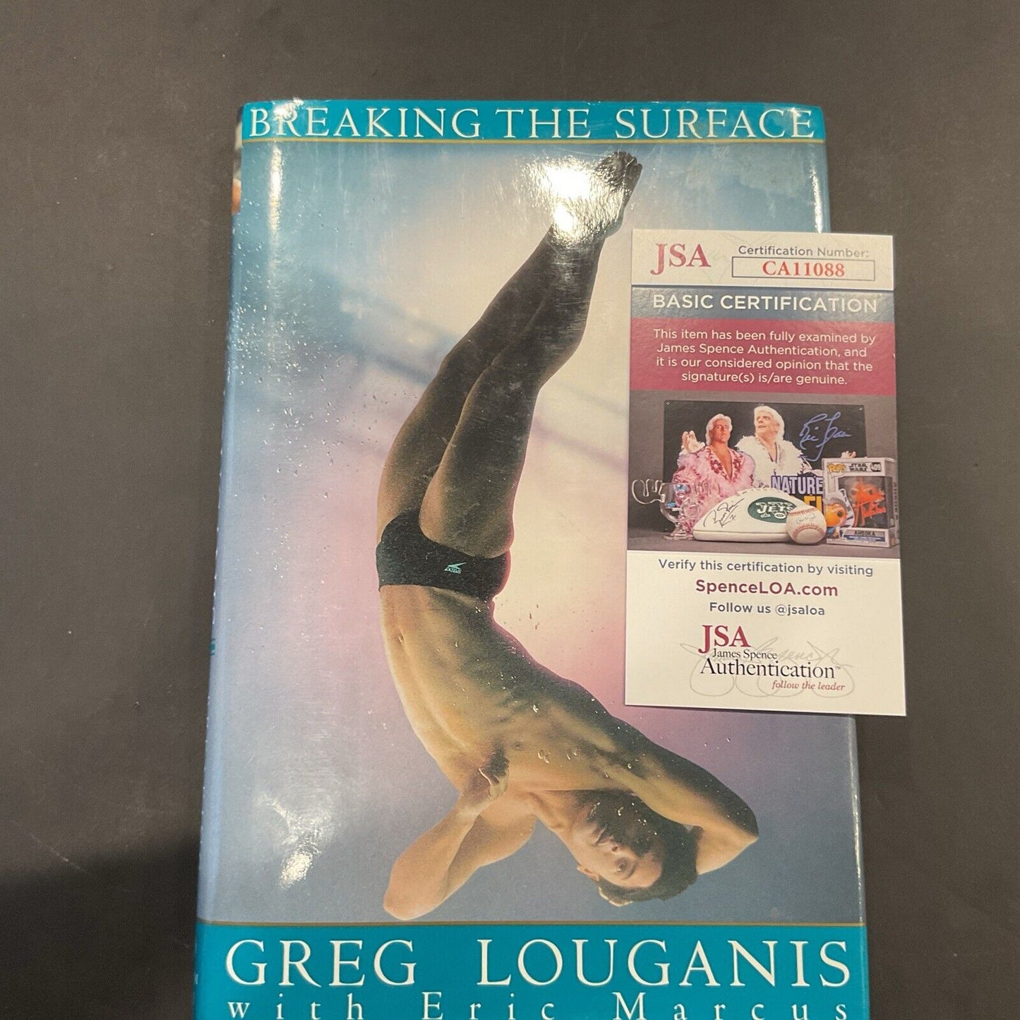 “Breaking the surface” Novel autographed Greg Louganis JSA coa 